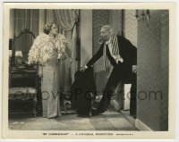 7h273 BY CANDLELIGHT 8x10.25 still 1933 Elissa Landi in cool feathered outfit stares at man in tux