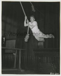 7h369 EAST OF EDEN candid 7.5x9.5 still 1955 great image of James Dean swinging on rope like Tarzan!