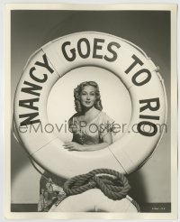 7h677 NANCY GOES TO RIO deluxe candid 8x10 still 1950 Ann Sothern posing in life preserver w/title!