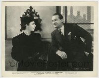 7h759 REBECCA 8x10.25 still 1940 Hitchcock, c/u of George Sanders smiling at crazy Judith Anderson!