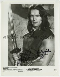 1b333 ARNOLD SCHWARZENEGGER signed 8x10.25 still 1981 best portrait w/sword in Conan the Barbarian!