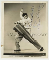1b390 DESI ARNAZ signed 8.25x10 still 1946 great portrait playing conga drum from Cuban Pete!