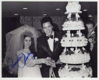1b946 PRISCILLA PRESLEY signed 8x10 REPRO still 1990s cutting cake at wedding with Elvis Presley!