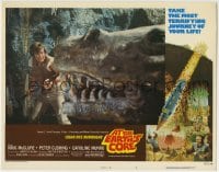 1b101 AT THE EARTH'S CORE signed LC #3 1976 by Doug McClure, who's close up facing a big dinosaur!