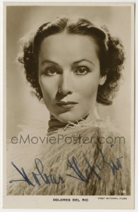 1b683 DOLORES DEL RIO signed English 4x6 postcard 1920s head & shoulders portrait with feathers!