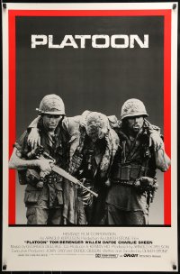 1c709 PLATOON int'l 1sh 1986 Charlie Sheen & Quinn helping with soldier, Oliver Stone, Vietnam War!