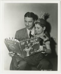 1h054 5000 FINGERS OF DR. T candid 8.25x10 still 1953 Seuss reading to Rettig w/ happy fingers hat!