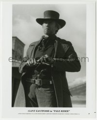2a739 PALE RIDER 8x10 still 1985 great close up of cowboy Clint Eastwood loading his gun!
