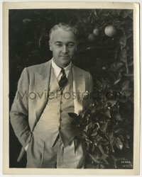 2a983 WILLIAM BOYD 8x10.25 still 1930s dapper portrait in suit & tie standing by orange tree!