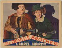 2w287 DEVIL'S BROTHER LC 1933 close up of Stan Laurel & Oliver Hardy with blunderbuss guns, rare!