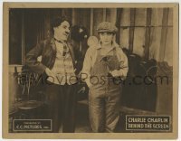 3z404 BEHIND THE SCREEN LC R1922 Tramp Charlie Chaplin laughs at Edna Purviance in overalls, rare!