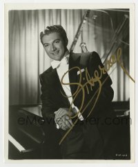 4t547 LIBERACE signed 8x10 still 1955 wonderful portrait sitting on his piano from Sincerely Yours!