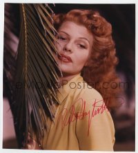 4t944 RITA HAYWORTH signed color 7.5x8.5 REPRO still 1980s c/u of the sexy redhead by palm tree!