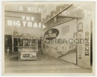 4x002 BIG TRAIL 8x10.25 still 1930 theater entrance showing giant displays, one with John Wayne!