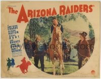 5b541 ARIZONA RAIDERS LC 1936 man tosses lasso around Buster Crabbe's neck while he's riding horse!
