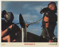 5h590 MAD MAX 2: THE ROAD WARRIOR int'l LC 1982 George Miller, great image of chained Vernon Wells!