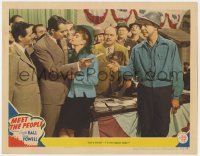 5h617 MEET THE PEOPLE LC 1944 Dick Powell stops man who thinks he's the high bidder on Lucille Ball