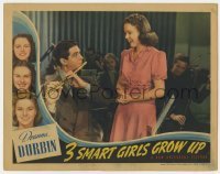 5h902 THREE SMART GIRLS GROW UP LC 1939 Deanna Durbin smiles at Bob Cummings playing flute!