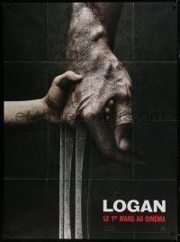 5j832 LOGAN teaser French 1p 2017 super c/u of tiny hand holding Hugh Jackman's Wolverine claw!