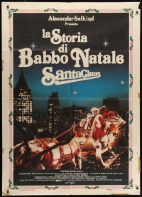 5j558 SANTA CLAUS THE MOVIE Italian 1p 1985 great image of Santa & reindeer flying over city!