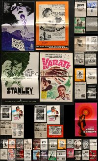 6h260 LOT OF 57 UNCUT PRESSBOOKS 1950s-1970s advertising for a variety of different movies!
