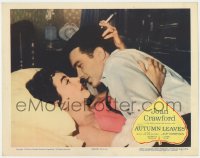 6m047 AUTUMN LEAVES LC 1956 c/u of smoking Joan Crawford & Cliff Robertson embracing in bed!