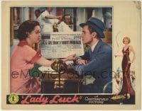 6m568 LADY LUCK LC 1936 Patricia Farr shows William Bakewell the newspaper headline, gambling art!
