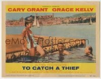 6m921 TO CATCH A THIEF LC #1 1955 Grace Kelly & Cary Grant swim on the Riviera, Alfred Hitchcock
