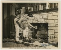6s296 GEORGE NADER signed 8x10 still 1954 candid of him at home putting pine cones in fireplace!