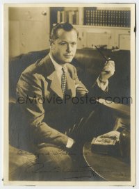 6s124 ROBERT MONTGOMERY signed 5x7 fan photo 1940s wearing a suit while smoking a pipe in his den!