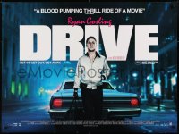 6y452 DRIVE DS British quad 2011 Ryan Gosling behind car w/bag, directed by Nicolas Winding Refn!