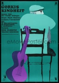 7f103 CHILDHOOD OF MAXIM GORKY German R1964 cool artwork of man in chair with guitar by Jan Lenica!