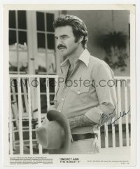 7s379 BURT REYNOLDS signed 8x10 still 1980 close up holding his hat in Smokey and the Bandit II!