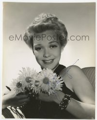 7s485 JANE WYMAN signed 7.5x9.25 still 1940s smiling close up holding flowers by George Hurrell!