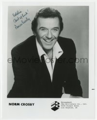 7s659 NORM CROSBY signed 8x10 publicity still 1970s great smiling portrait from his talent agency!