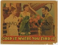 8d492 GOLD IS WHERE YOU FIND IT LC 1938 George Brent brings flowers to Olivia De Havilland & Lindsay