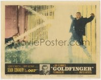 8d496 GOLDFINGER LC #3 1964 Sean Connery as James Bond watches Oddjob get electrocuted on fence!