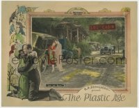8d756 PLASTIC AGE LC 1925 man helps beautiful Clara Bow get into car by log cabin, ultra rare!