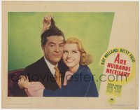 8j387 ARE HUSBANDS NECESSARY LC 1942 great c/u of pretty Betty Field holding up Ray Milland's hair!