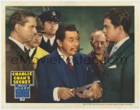 8r144 CHARLIE CHAN'S SECRET LC 1936 smiling Asian Warner Oland grabs man's hand & puts knife on it!