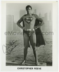 8y673 CHRISTOPHER REEVE signed 8x10 REPRO still 1980s wonderful portrait in costume as Superman!