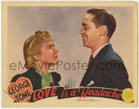 9b535 LOVE IS A HEADACHE LC 1938 c/u of Franchot Tone smiling down at irritated Gladys George!