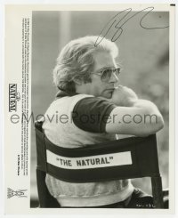 9r295 BARRY LEVINSON signed 8.25x10 still 1984 candid in his chair on the set of The Natural!