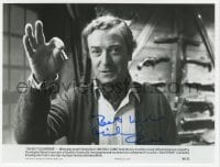 1h449 MICHAEL CAINE signed 7.25x9.5 still 1982 c/u with keys to Houdini's handcuffs in Deathtrap!
