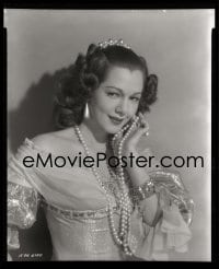 1x049 EXILE 8x10 negative 1947 c/u of beautiful Maria Montez holding pearl necklace to her face!