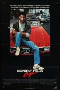 1y089 BEVERLY HILLS COP 1sh 1984 great image of detective Eddie Murphy sitting on red Mercedes!