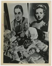 2a469 IRVING KLAW 8x10.25 still 1940s at his desk surrounded by photos of Hollywood stars!