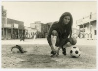 2a738 RAQUEL WELCH deluxe 6.5x9.25 still 1971 putting on soccer outfit with holster by O'Neill!