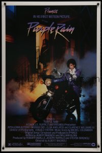 2b873 PURPLE RAIN 1sh 1984 great image of Prince riding motorcycle, in his first motion picture!