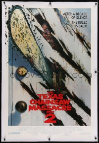 2h292 TEXAS CHAINSAW MASSACRE PART 2 linen 1sh 1986 Tobe Hooper horror sequel, cool Huston art!